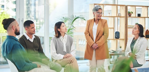 Preview: Support, group therapy and senior woman talking in meeting, conversation and wellness. Counseling,