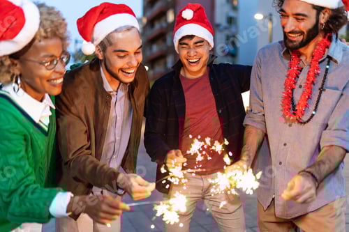 Preview: Group of diverse young people celebrating christmas or new year in city street