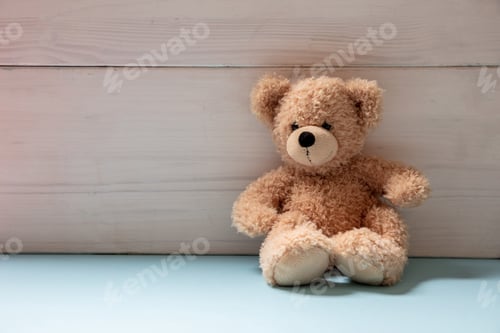 Preview: Teddy bear sitting on blue floor, child room