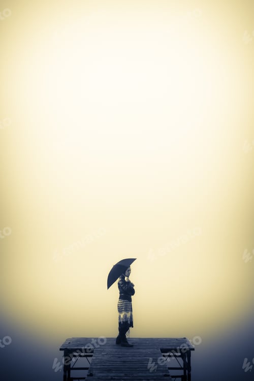 Preview: Lonely woman looks to the misty lake