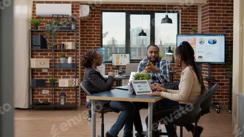 Preview: Team of business people working on financial analysis