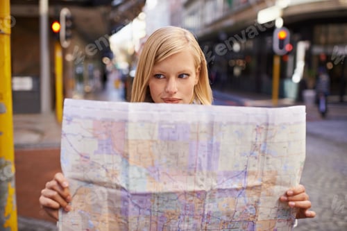 Preview: I think Im lost...Shot of a young woman holding a map while touring abroad.