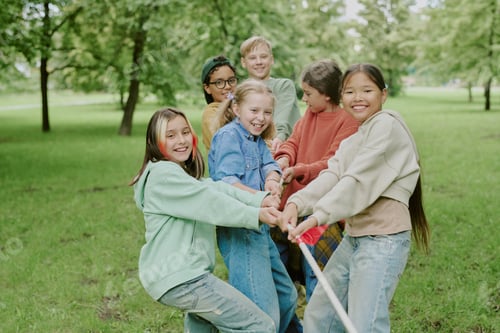 Preview: Multiethnic Group of Children Playing Tug of War Outdoors
