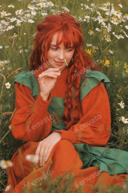Preview: A shepherdess woman with red hair and a green dress sits in a field of flowers.