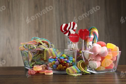 Preview: Candy bar. Many different tasty sweets on wooden table