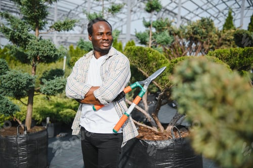 Preview: african american male garden worker works