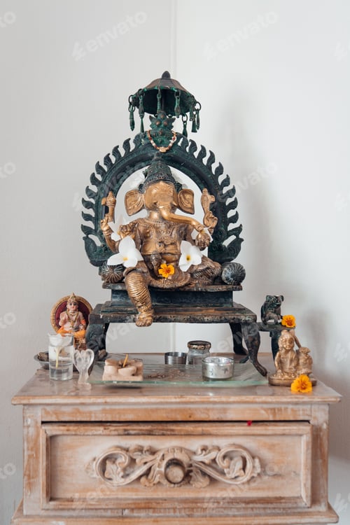 Preview: Vertical shot of an old Indian statue of Ganesh on white wall background
