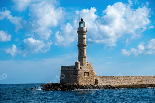 Preview: Crete Greece. Lighthouse, beacon at Venetian harbour in Old Town of Chania. Sunny day