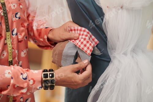 Preview: Tailor Choosing Fabric for Dress