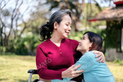 Preview: Senior on wheelchair and daughter family concept, Young asian woman smiling and hugging with mother