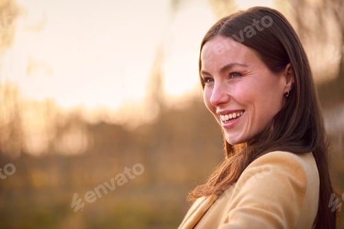 Preview: Head And Shoulders Portrait Of Woman On Walk Through Autumn Or Winter Countryside