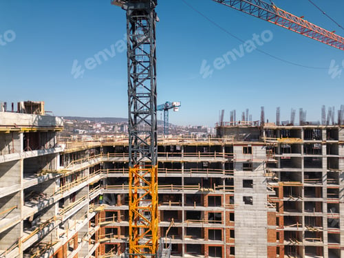 Preview: Construction site of a high-rise building at sunny day. The structure's concrete framework, cranes