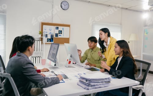 Preview: Business people working and discussing business strategy in modern office