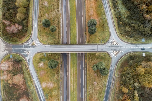 Preview: Aerial shot of a busy intersection with multiple lanes of highway traffic