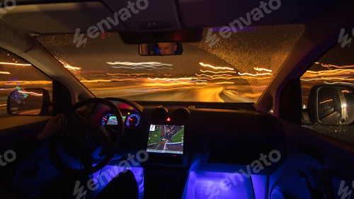 Preview: The man drive with a gps on the night road. Inside view. Wide angle