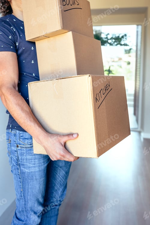 Preview: Man carrying moving boxes