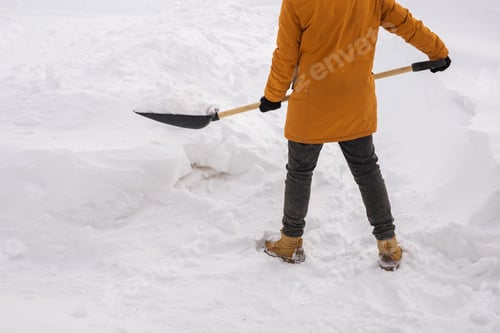 Preview: Close up man cleaning snow from sidewalk and using snow shovel. Winter season