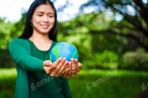 Preview: A male hand holds a hammer, symbolizing the enforcement of tree conservation laws. This highlights