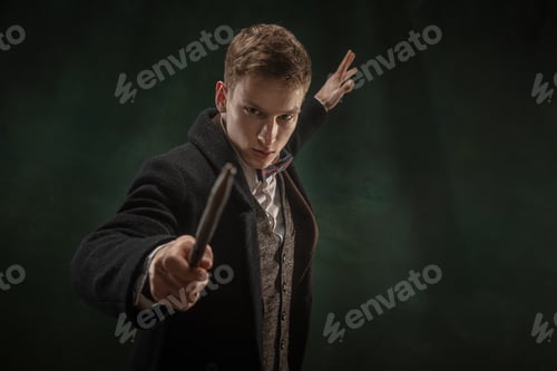 Preview: Young man in art action isolated on dark green background. Retro style, comparison of eras concept