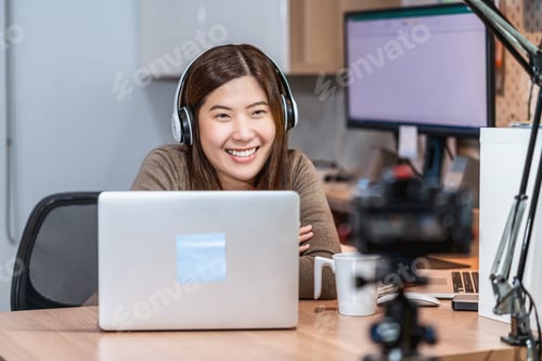 Preview: Asian business woman using technology laptop and working from home in home offuce, freelance
