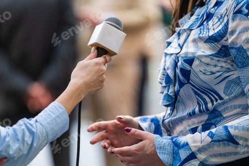 Preview: A journalist conducts an interview, capturing reactions and insights during the opening ceremony