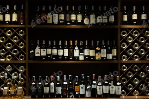Preview: Bar counter with defocused background and wine bottles of restaurant, bar or cafeteria.