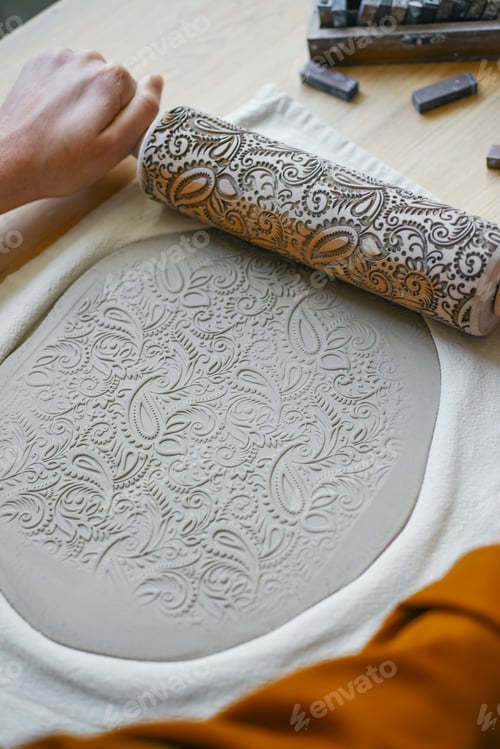 Preview: Decorating clay blank with pattern, stamping rolling pin with ornamentation