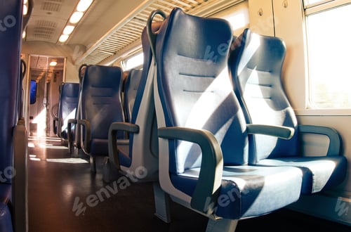 Preview: Interior of a passenger train with empty seats.