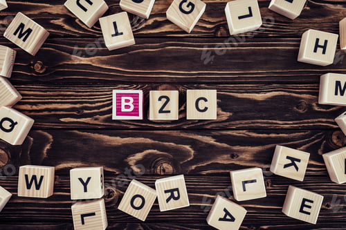 Preview: flat lay with b2c inscription made of wooden blocks on brown wooden tabletop