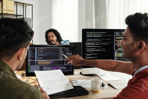 Preview: Team of Programmer Working in Office