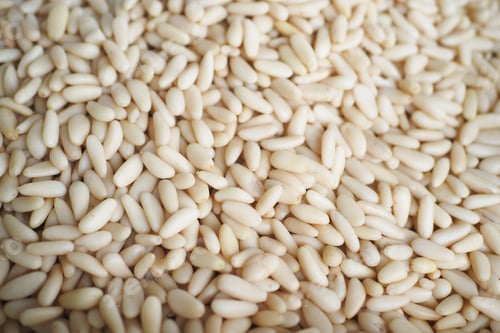 Preview: overhead view of pine nuts in a bowl