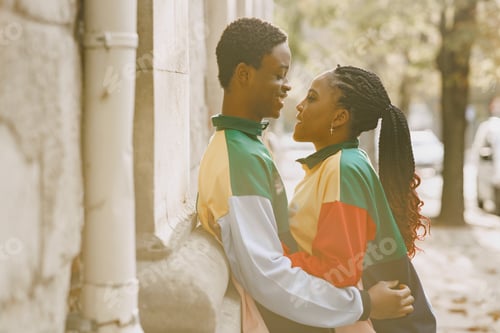 Preview: Ethnic couple walking in city street