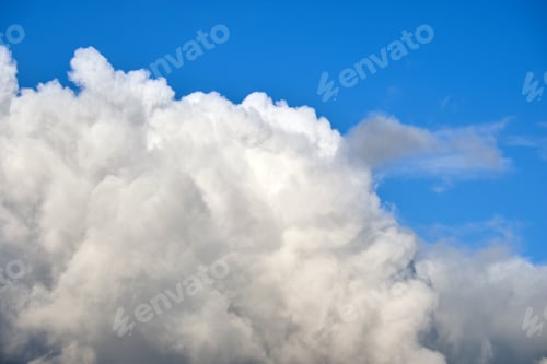 Preview: Bright landscape of white puffy cumulus clouds on blue clear sky