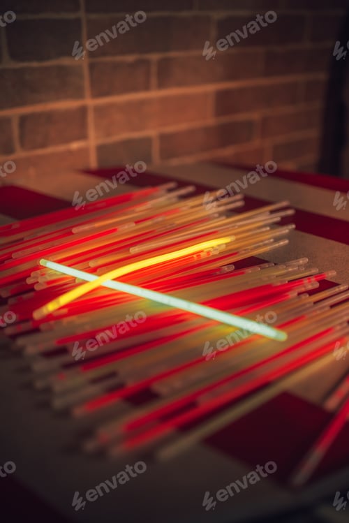 Preview: Collection of glowsticks on a night party
