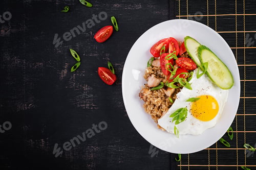 Preview: Nasi Goreng. Indonesian chicken fried rice on dark background