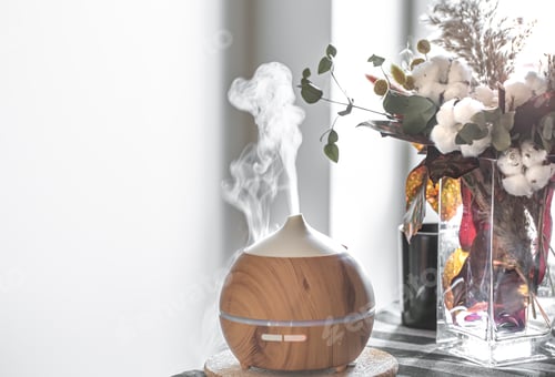 Preview: Modern oil aroma diffuser in the living room on the table copy space.