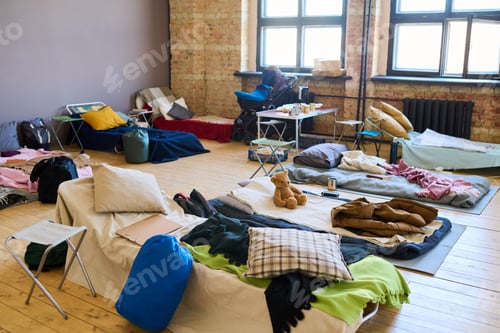 Preview: Large group of sleeping places prepared for refugees in spacious room
