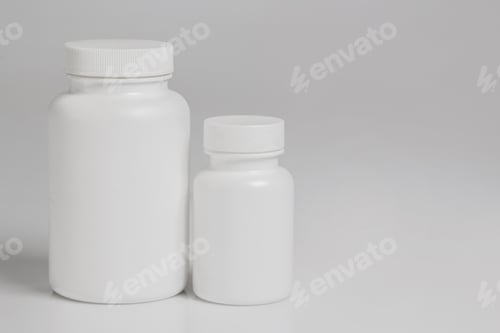 Preview: Two Pill Bottles on Light Background in Studio