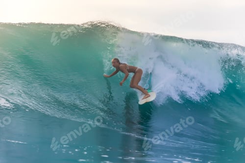 Preview: Surfer girl on a wave,Bali,Indonesia