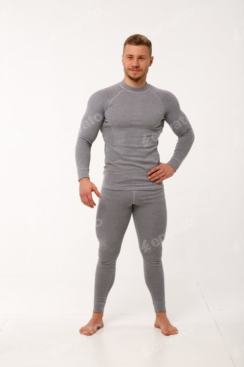 Preview: A man with a sporty physique in thermal underwear.