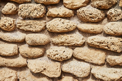Preview: Background of the stone wall of the castle made of stones of different shapes and sizes and textures