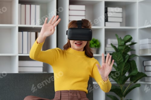 Preview: Attractive Asian woman resting comfortable living room and using AR glasses, Relax, Sofa, Lifestyle