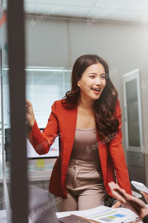 Preview: Asian businesswoman smiling enjoying office meeting discussion