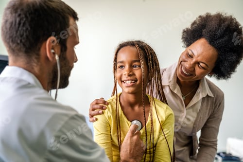 Preview: Pediatrician examining a little african girl at hospital. Healthcare, people concept
