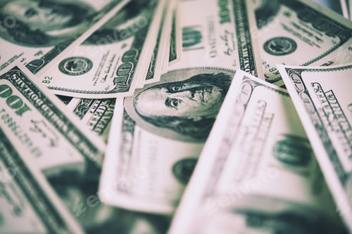 Preview: Working place of trader. The table covered by cash notes, keyboard and financial charts.