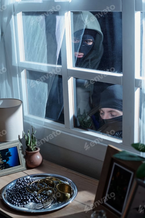 Preview: Two Masked Men Peering through Window Planning Jewelry Robbery
