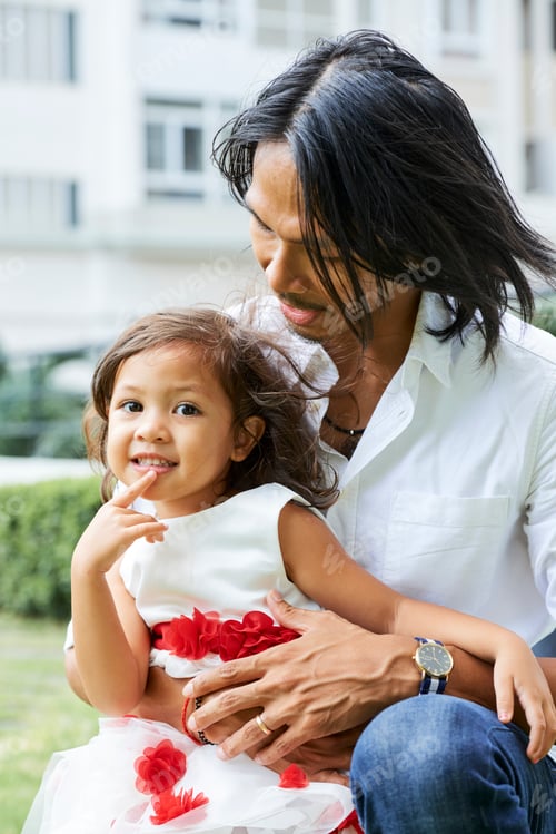 Preview: Father Looking at Playful Daughter
