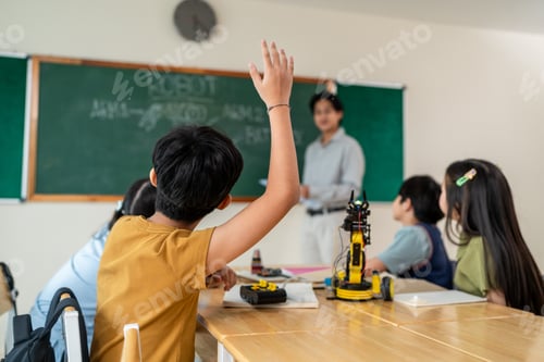 Preview: Group of students learning in a robotics class at elementary school.