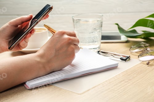 Preview: Girl writes in a notebook. Business or blogger concept