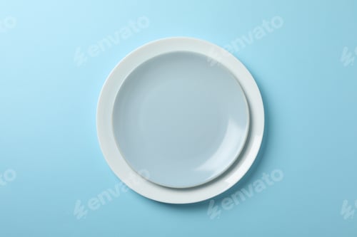 Preview: Plates on blue background, top view and space for text